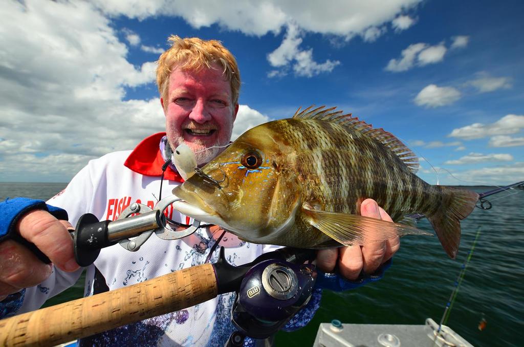 Graham Brake with a nice grassy sweetlip from the mouth of the Jackson River, Cape York. © Lee Brake